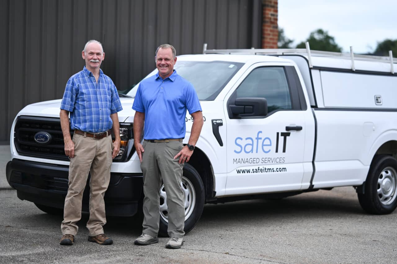 Safe Technicians beside a Safeit truck.